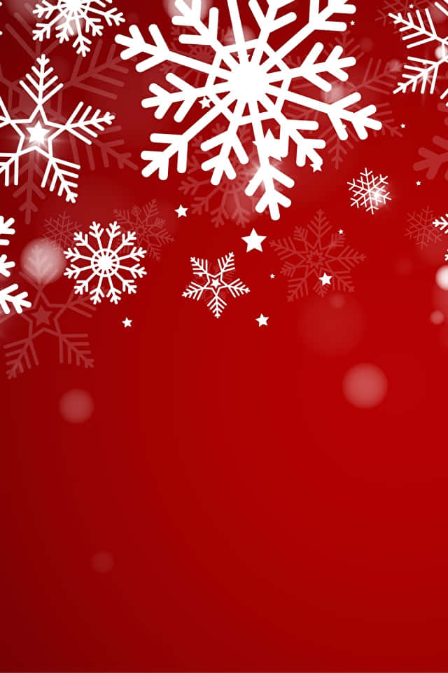 640x960 桌布 壁紙 — 鮮豔的紅色背景上飾有精緻的白色雪花和閃爍的星星，營造出節日冬季假期的氛圍。