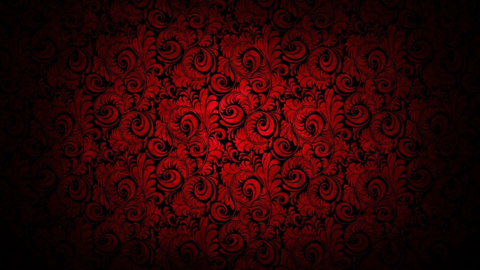 High Resolution Red 桌布 壁紙 — 鮮豔的紅色裝飾漩渦和葉子圖案在深黑色背景上形成強烈對比，這款壁紙細節豐富。