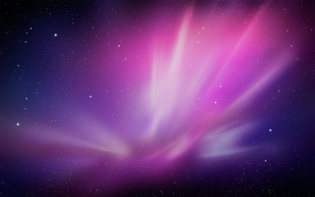 Mac Os 桌布 壁紙 — 鮮豔的紫色和粉紅色宇宙射線從星場中爆發，映襯著深靛藍色的夜空。