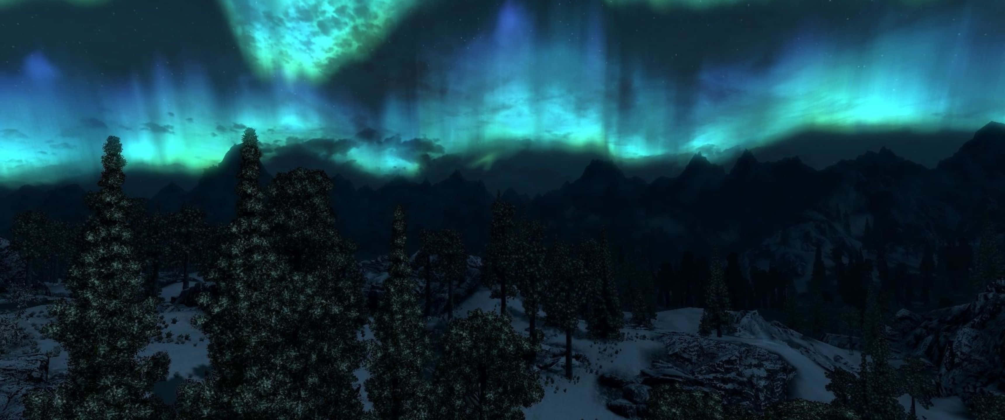 3440x1440p The Elder Scrolls V Skyrim 桌布 壁紙 — 鮮豔的綠色和藍色極光在星空下的雪山景觀上舞動。