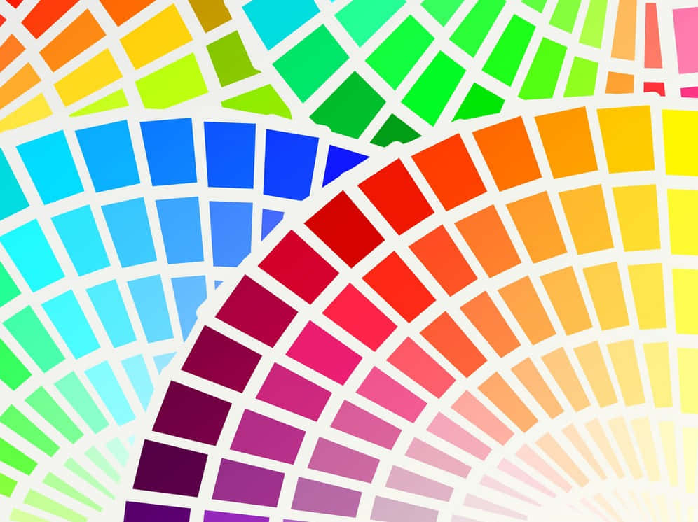 Spectrum 桌布 壁紙 — 鮮豔的色票以弧形排列，形成動態的彩虹漸變圖案。