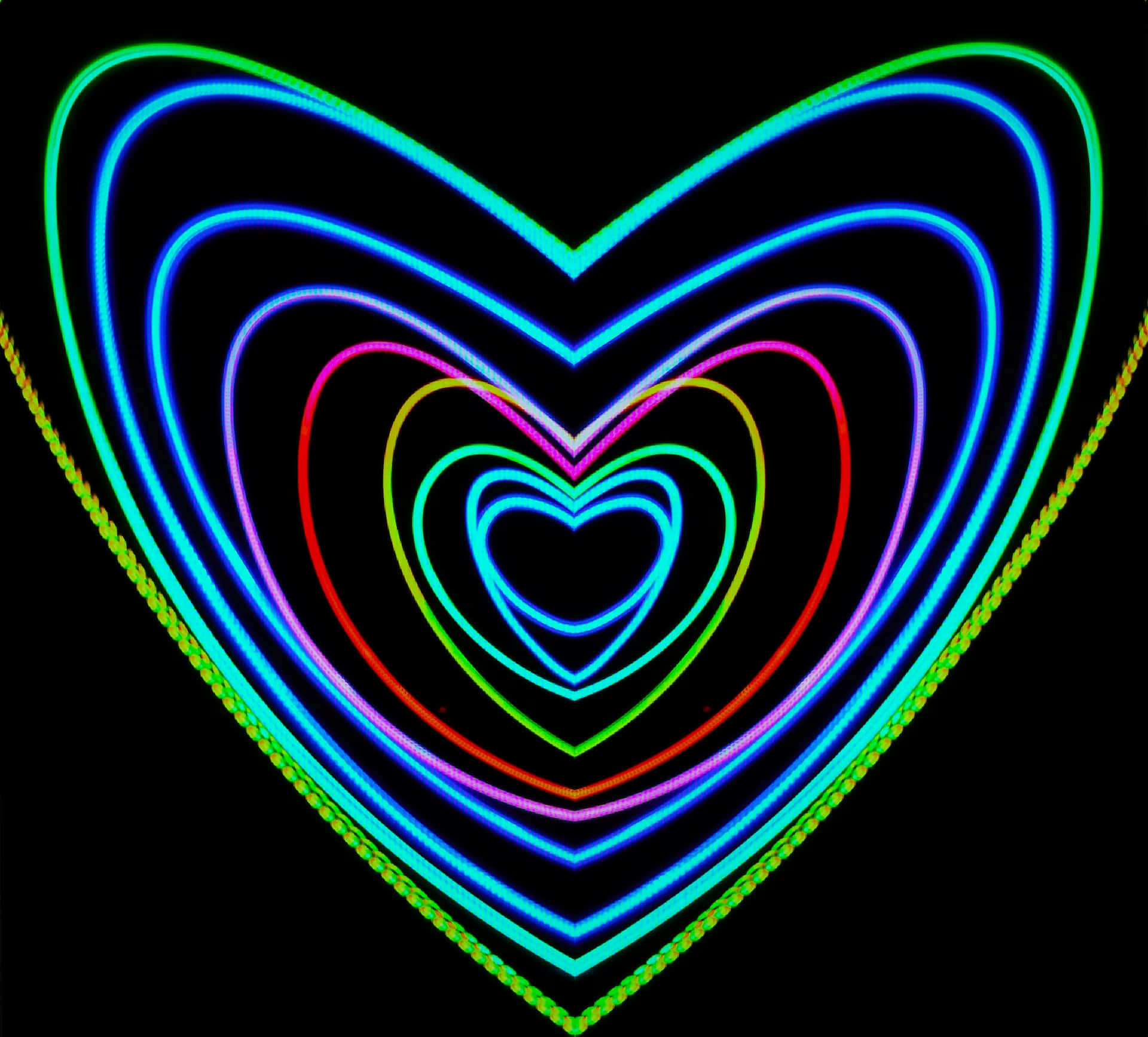 Psychedelic Neon Lights 桌布 壁紙 — 鮮豔的霓虹心形在漆黑背景上以同心層次發光，散發出藍、綠、粉紅和紅色的電光色調。