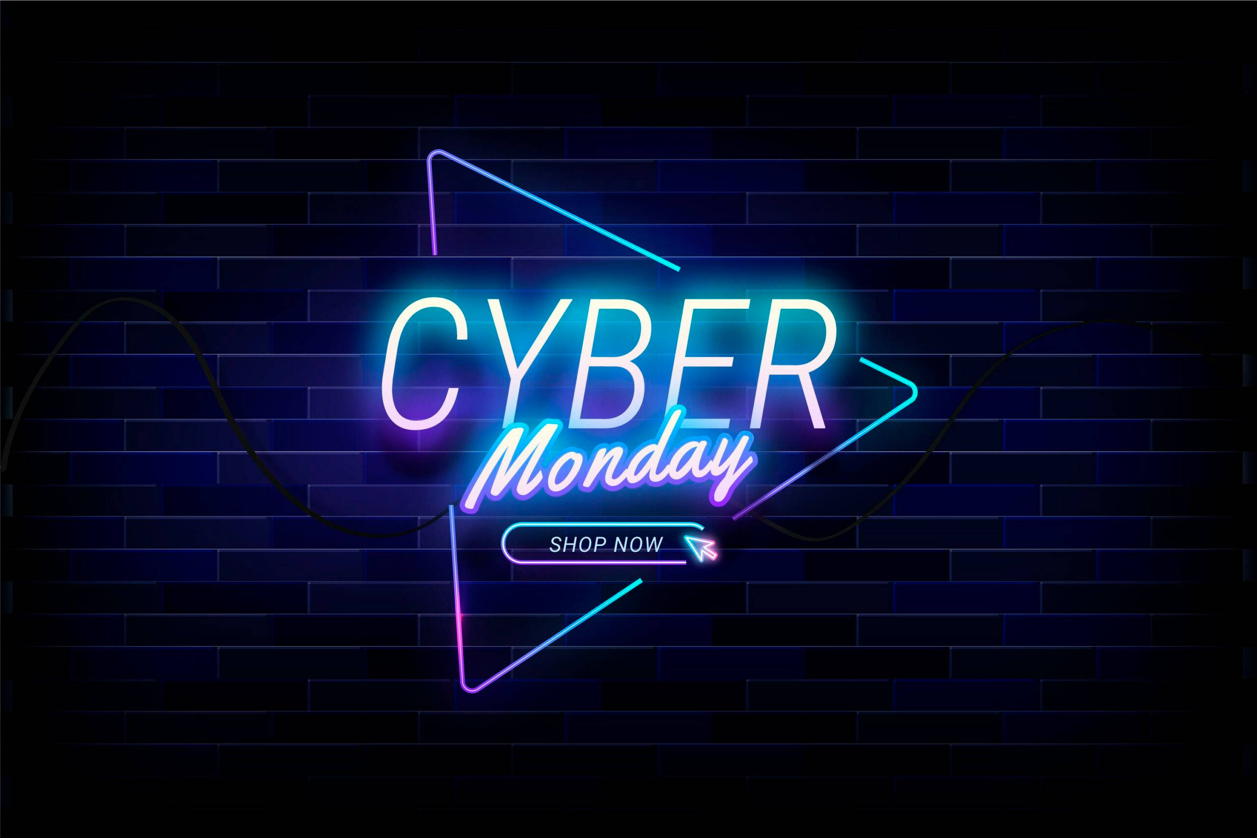 Sales 桌布 壁紙 — 鮮豔的霓虹燈牌在深色磚牆上閃爍著「CYBER Monday」和「SHOP NOW」。