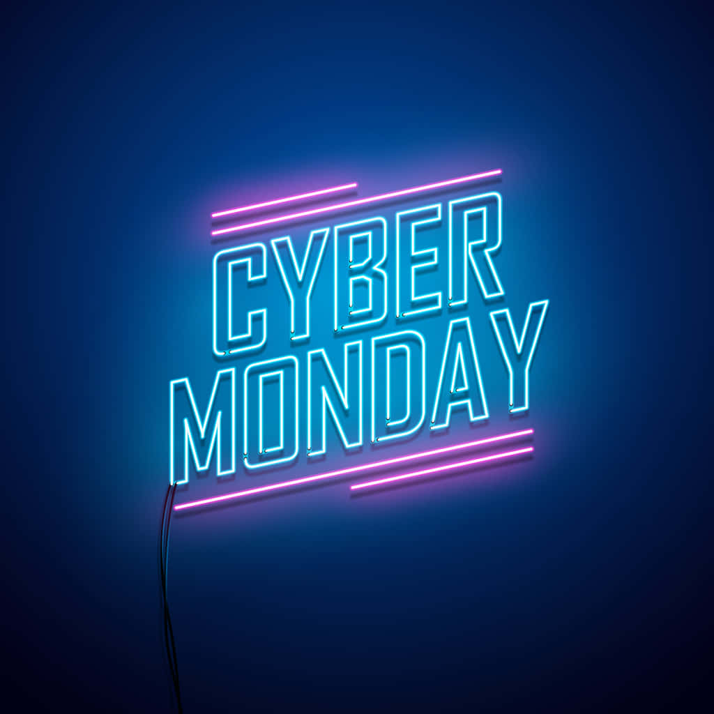 Monday 桌布 壁紙 — 鮮豔的霓虹燈牌在深藍色牆壁上發出藍色和粉紅色的光芒，拼出「CYBER MONDAY」。