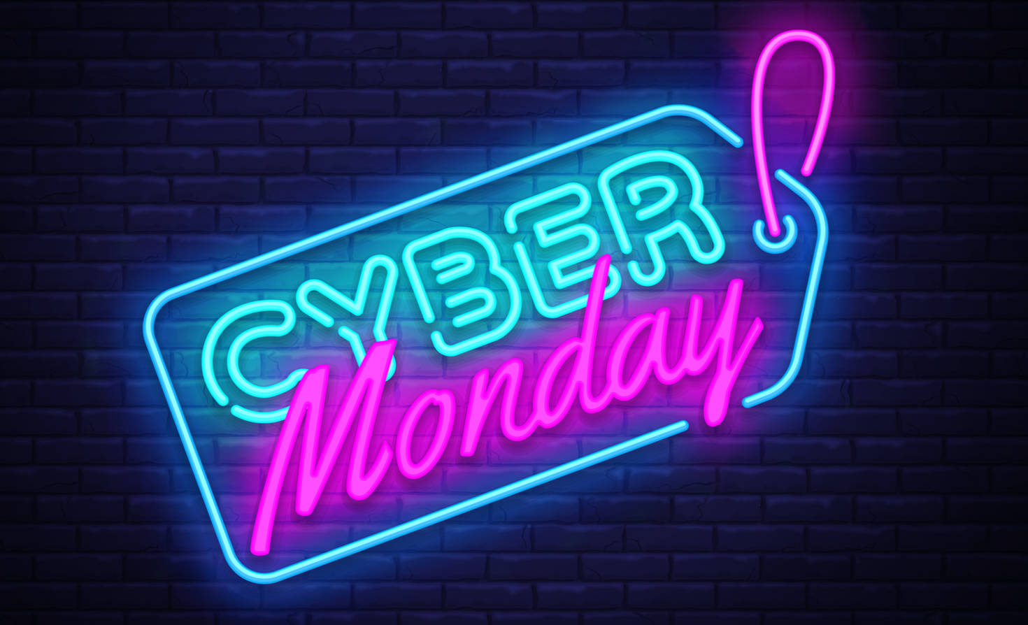 Monday 桌布 壁紙 — 鮮豔的霓虹燈牌寫著「Cyber Monday」，藍色和粉紅色在深色磚牆上發光。