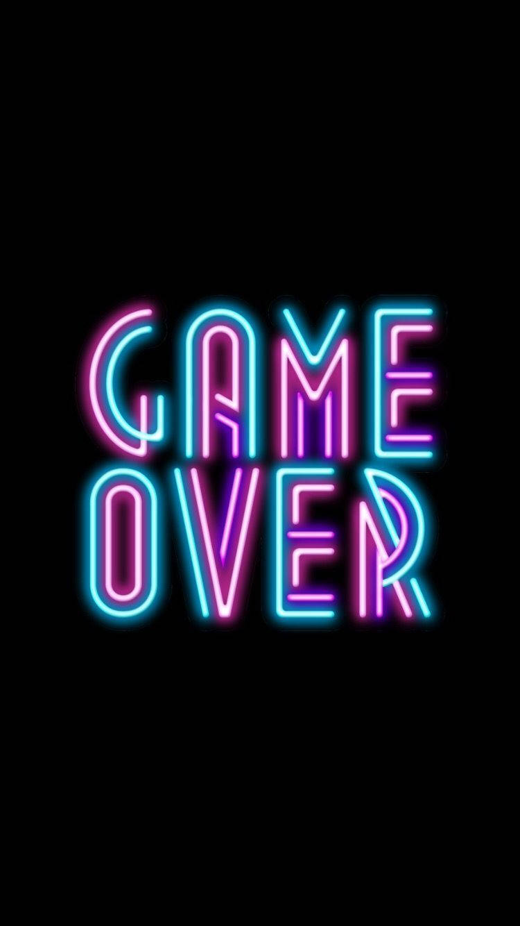 lights 桌布 壁紙 — 鮮豔的霓虹粉紅和藍色 'GAME OVER' 文字在純黑背景上發光。