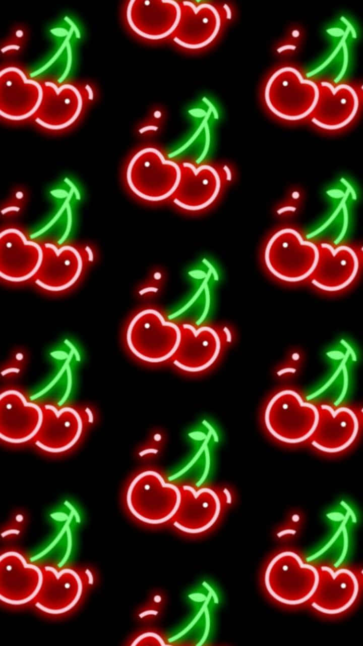 Cherry Aesthetic 桌布 壁紙 — 鮮豔的霓虹紅和綠色櫻桃輪廓在漆黑的背景上以重複圖案發光。