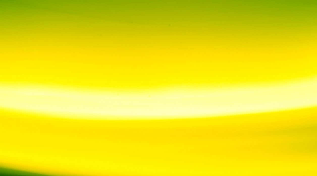 Yellow Abstract 桌布 壁紙 — 鮮豔的黃色和綠色色調在畫面中柔和地漸變。