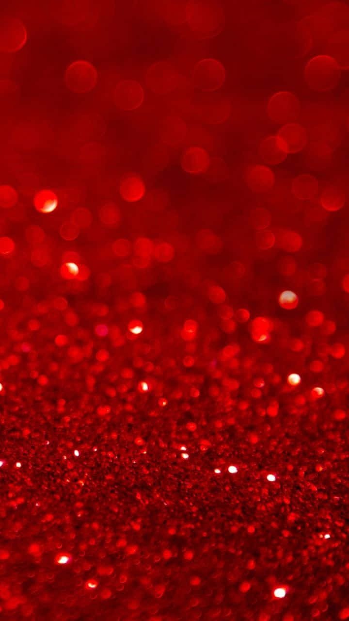 Red Cute Aesthetic 桌布 壁紙 — 鮮豔紅色亮粉的特寫，搭配散景燈光，營造出閃爍的節日質感。