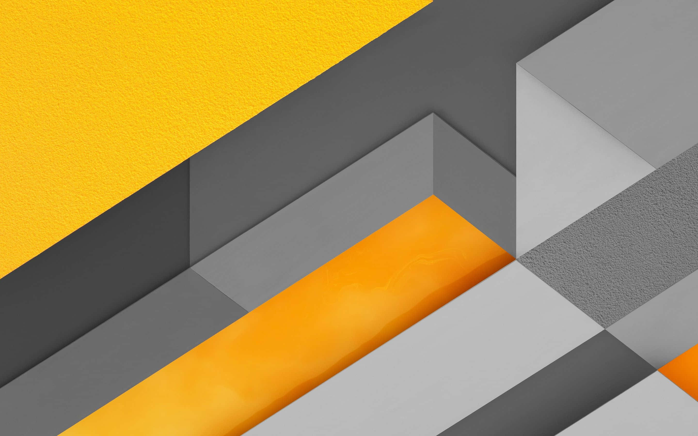Yellow Geometric 桌布 壁紙 — 鮮黃色和橙色的幾何形狀與帶紋理的灰色面板形成對比，構成現代抽象構圖。