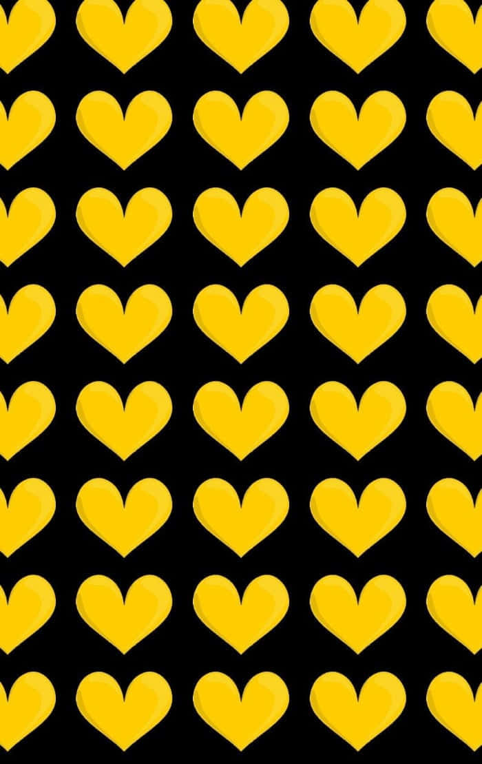 Yellow Heart 桌布 壁紙 — 鮮黃色的心形整齊排列，在純黑背景上發光，形成大膽的圖案。