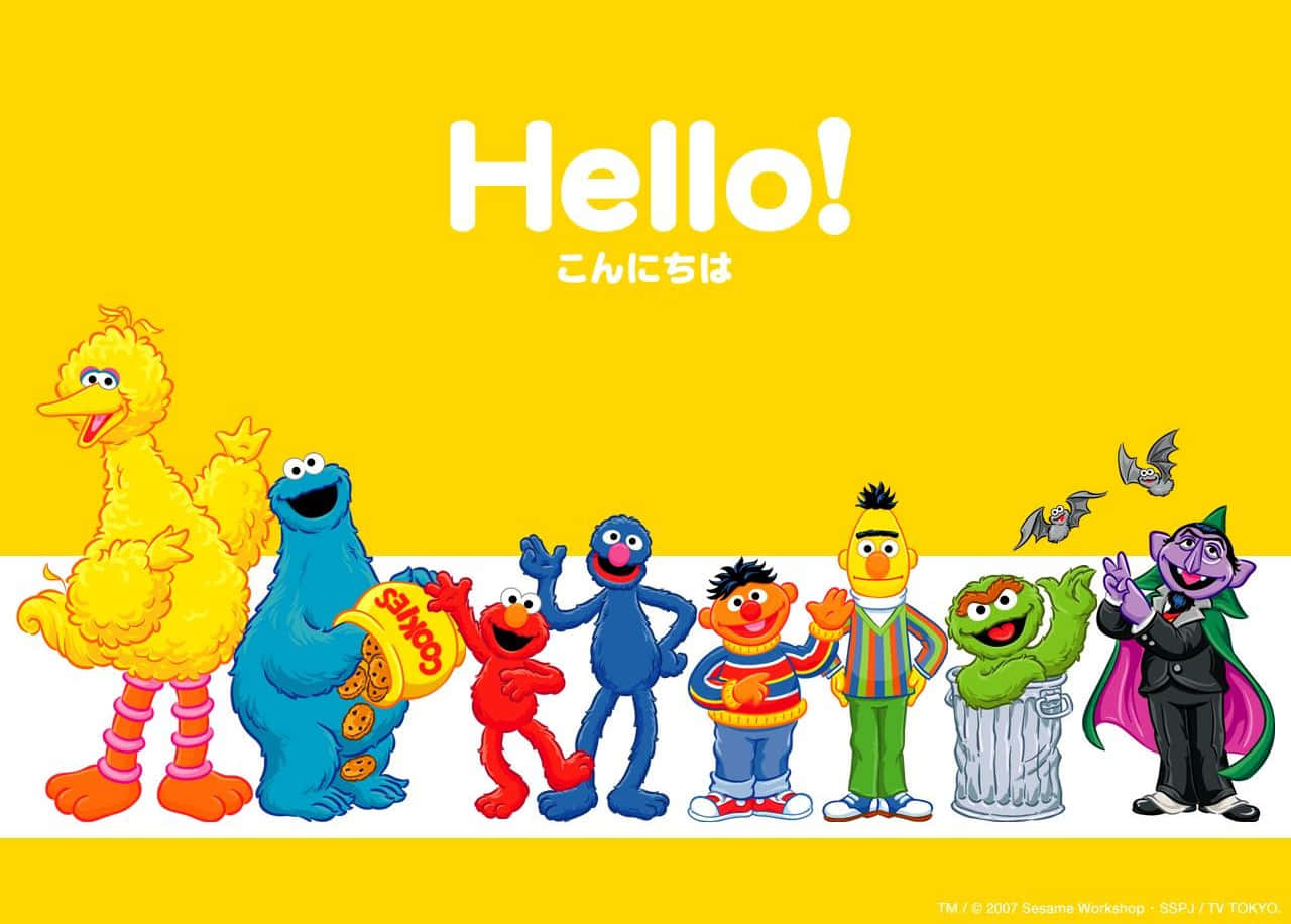 Big Bird 桌布 壁紙 — 鮮黃色背景上，經典芝麻街角色在粗體白色「你好！」文字下愉快揮手。