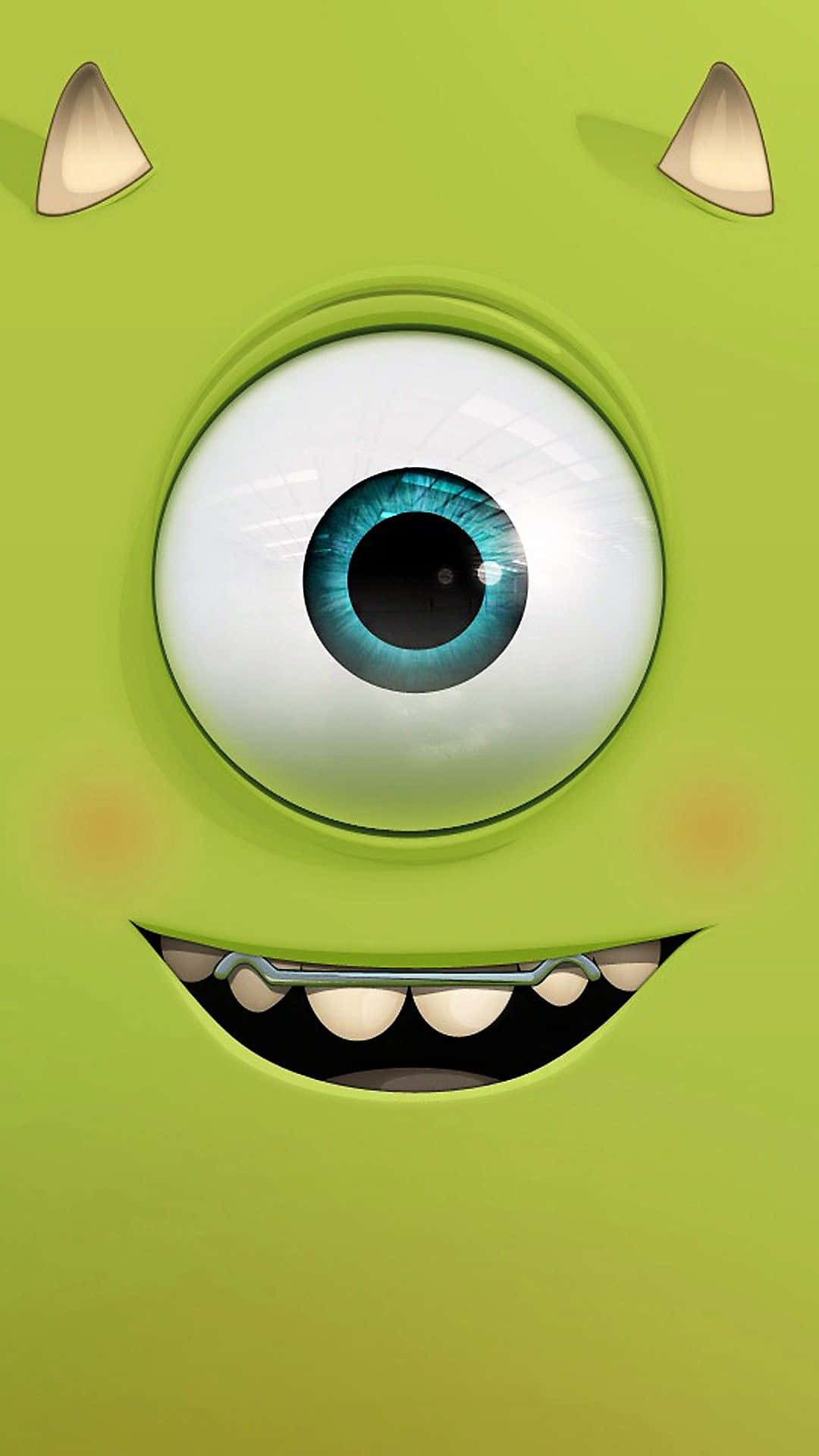 Cartoon Characters 桌布 壁紙 — 麥克華斯基愉快綠色臉龐的特寫，有一隻大藍眼睛和露齒笑容。