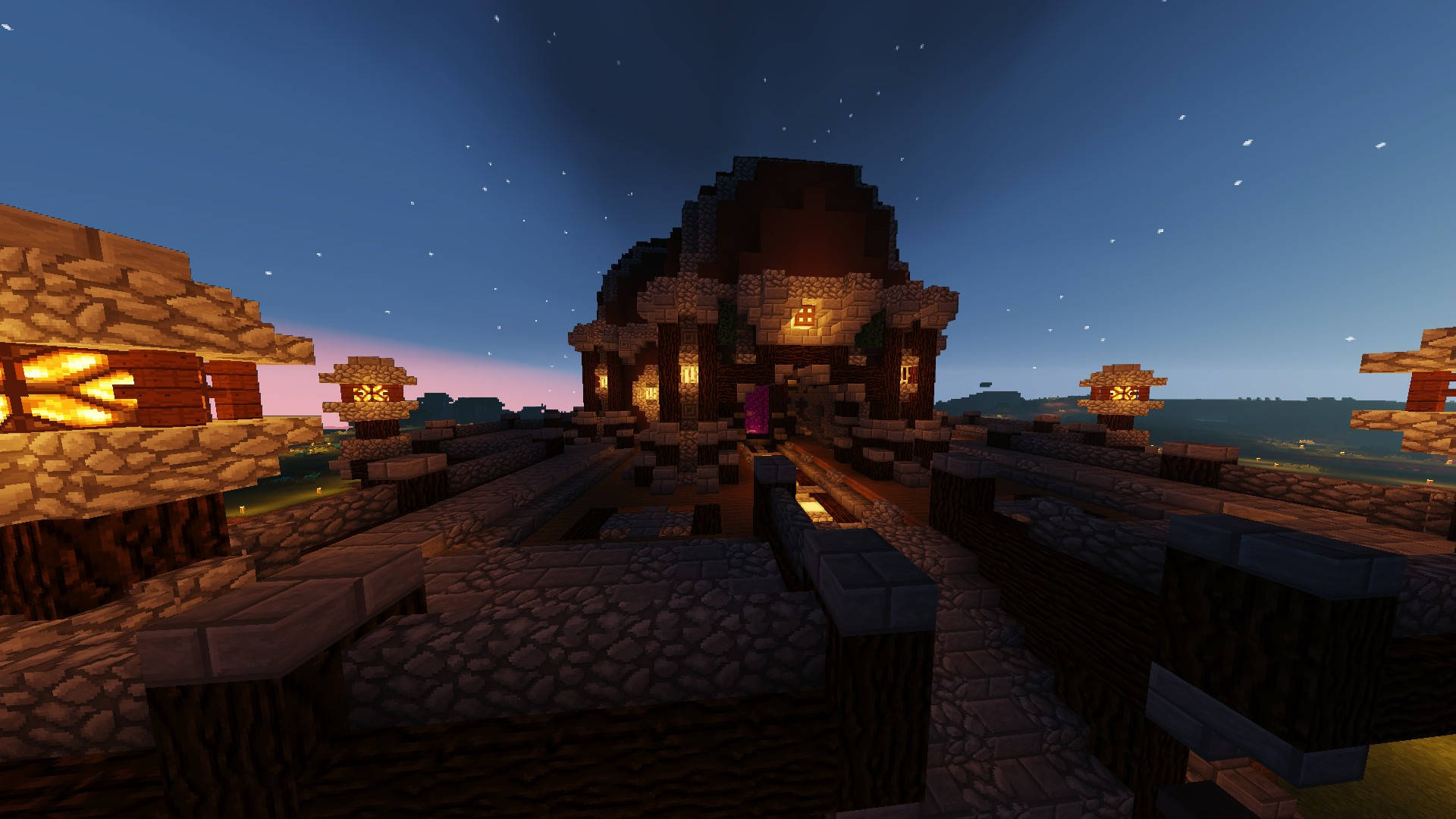 City Night 桌布 壁紙 — 黃昏時分，一個舒適的Minecraft村莊，有發光的燈籠和石屋，星空下。