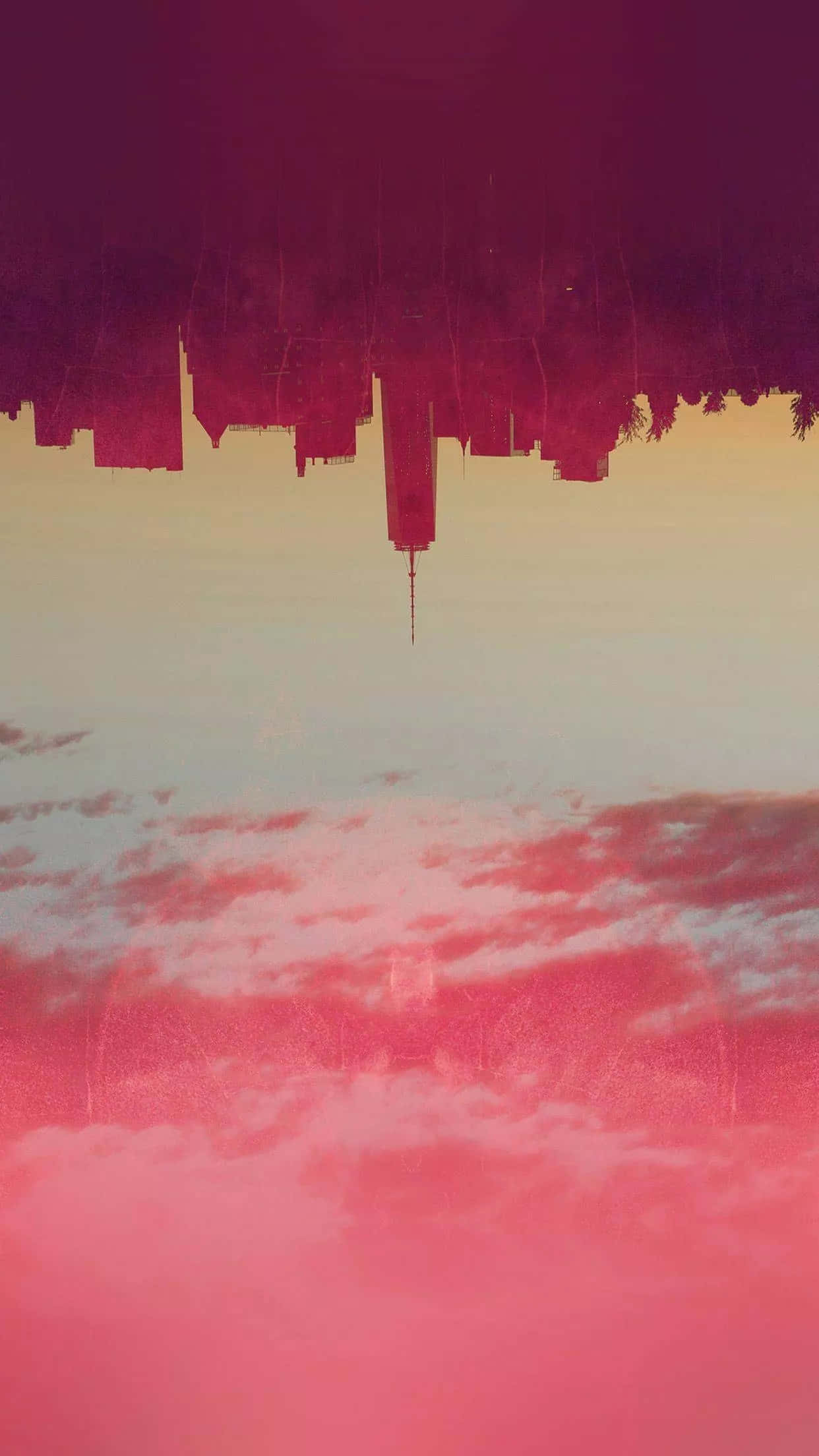 復古美學 桌布 壁紙 — 黃昏時分，粉紅色和紫色雲彩的天空中倒映出超現實的倒置城市景觀。
