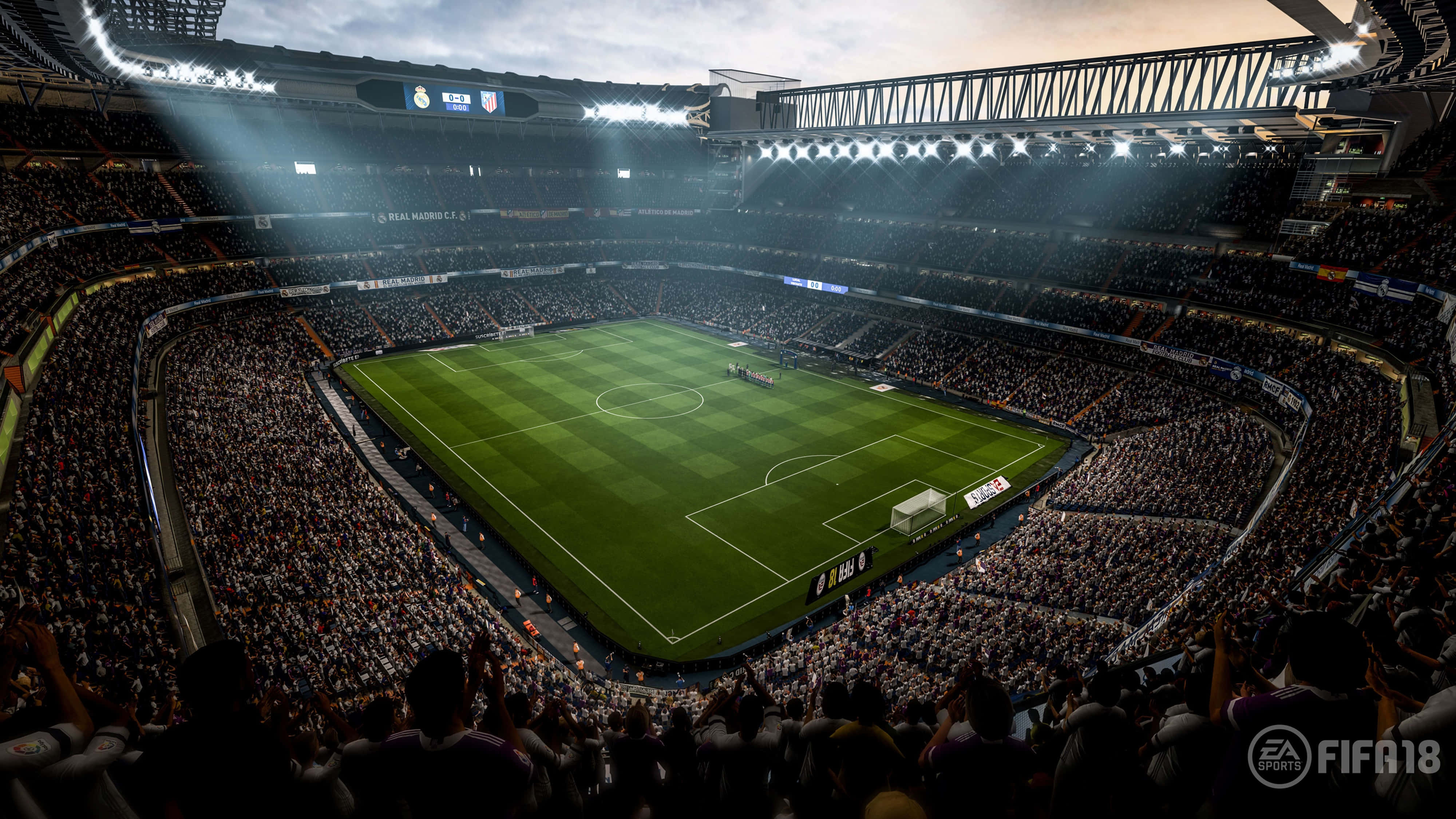 Soccer 4K 桌布 壁紙 — 黃昏時分擠滿觀眾的足球場鳥瞰圖，明亮泛光燈照亮綠色球場和歡呼的球迷。