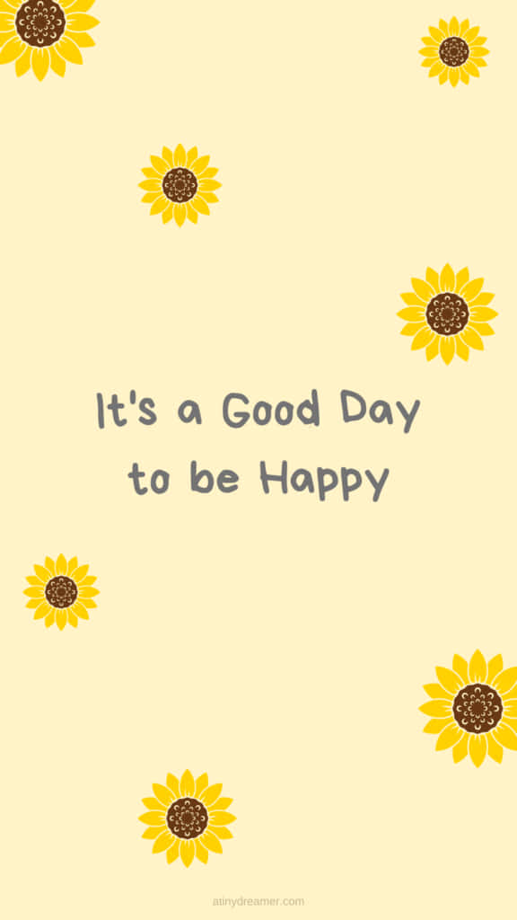 Sunflower Yellow 桌布 壁紙 — 黃色向日葵漂浮在淡黃色背景上，圍繞著文字「It's a Good Day to be Happy」。