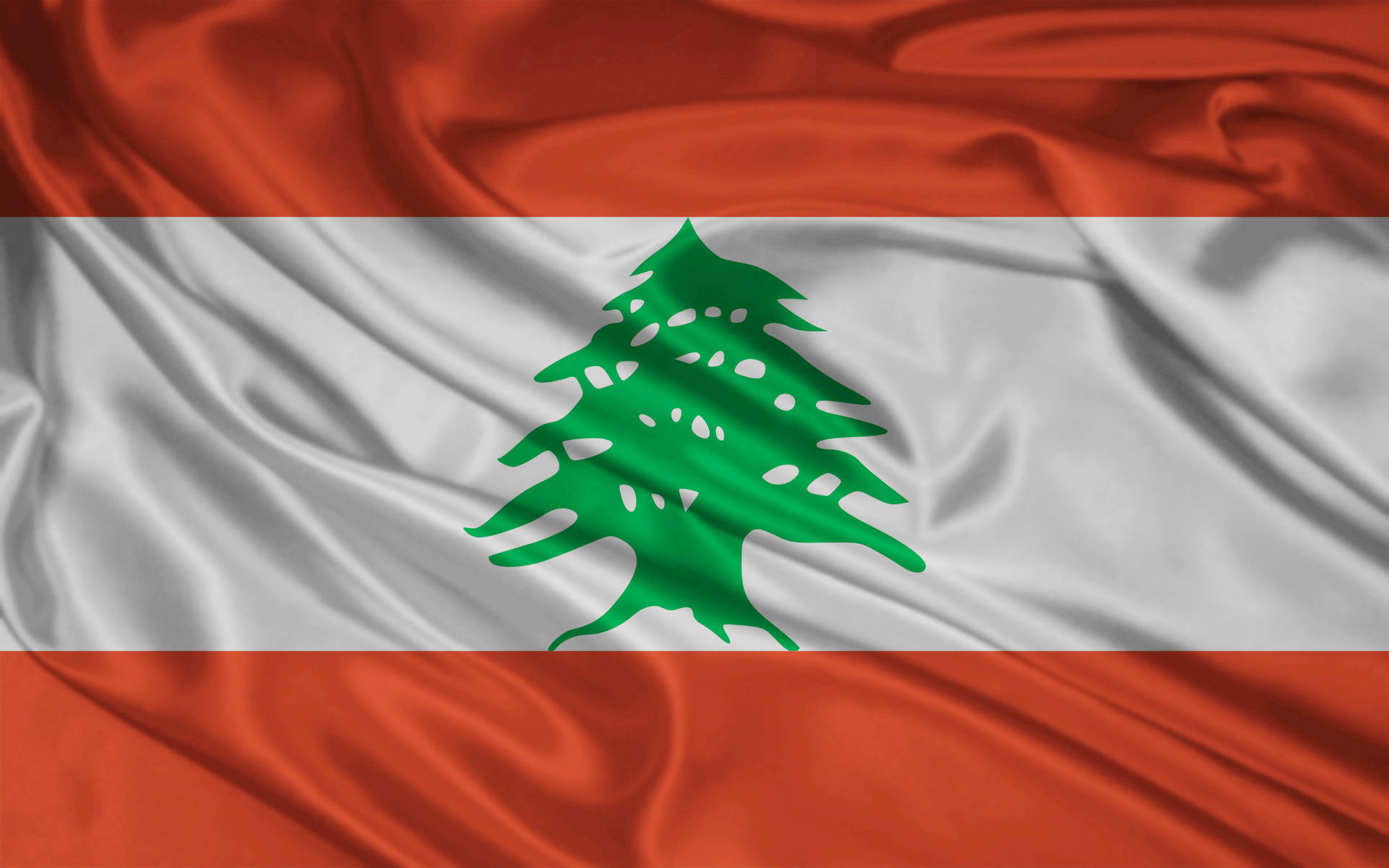 Lebanon 桌布 壁紙 — 黎巴嫩國旗，紅白綠條紋和雪松樹標誌，在緞面質感中動態飄揚。