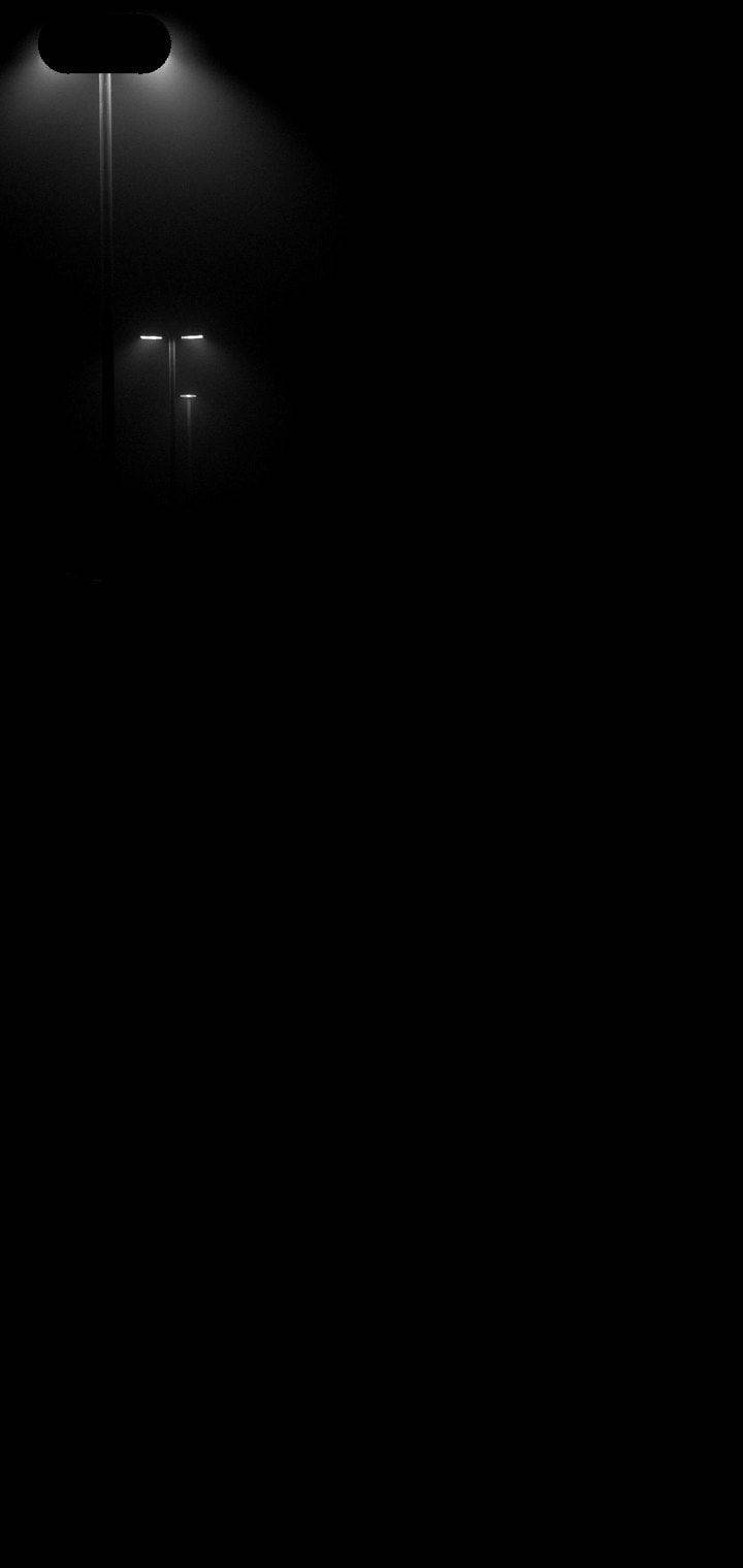 Light 桌布 壁紙 — 黑暗的城市夜景，微弱的街燈在黑暗中投射出柔和的光芒。