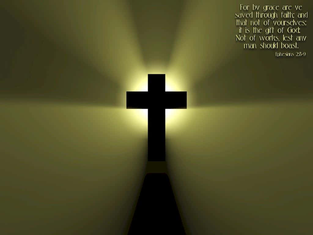 Jesus Saves 桌布 壁紙 — 黑暗隧道盡頭髮光的十字架散發出溫暖的光芒，角落有聖經經文。