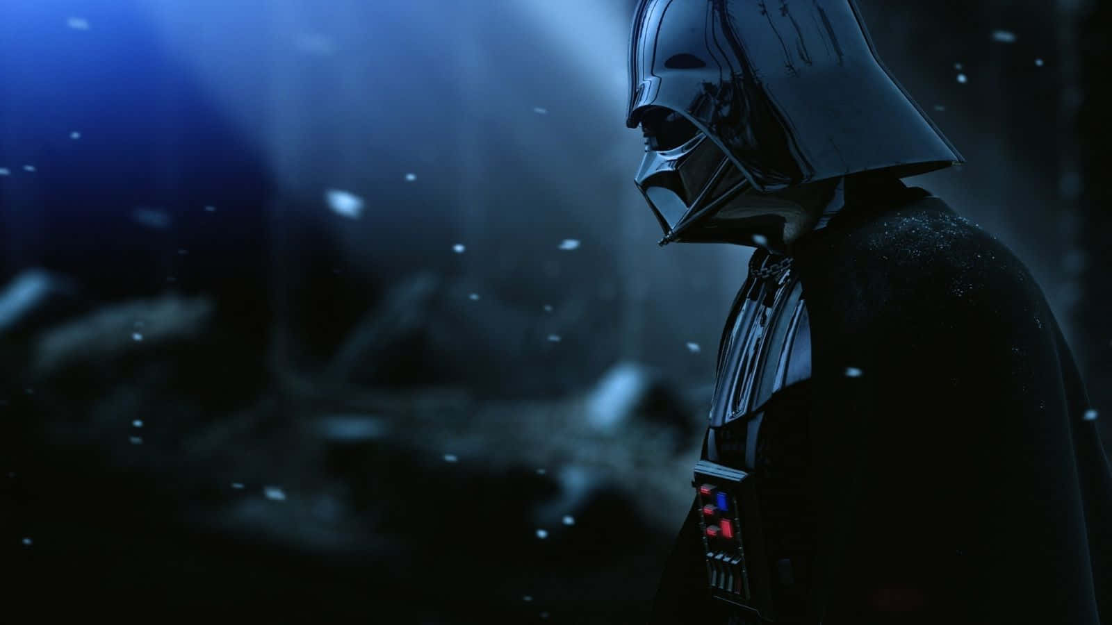 1600x900 桌布 壁紙 — 黑武士站在陰暗的藍光中，雪花飄落在他標誌性的頭盔和斗篷周圍。