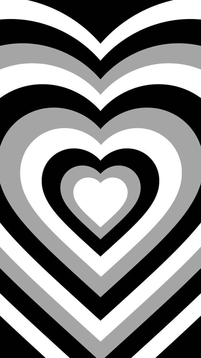Heart 桌布 壁紙 — 黑白灰嵌套心形的催眠圖案，營造出大膽的幾何視覺效果。
