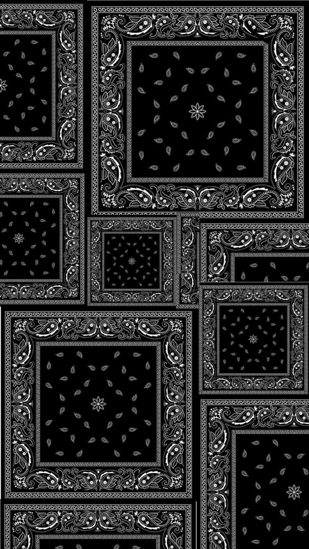 bandana 桌布 壁紙 — 黑白重複的頭巾圖案，帶有華麗邊框和葉子圖案，呈現幾何拼貼風格。