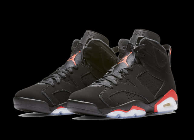 Product 桌布 壁紙 — 黑色Jordan 6運動鞋，帶橙色Jumpman標誌和紅白鞋底，純黑色背景。