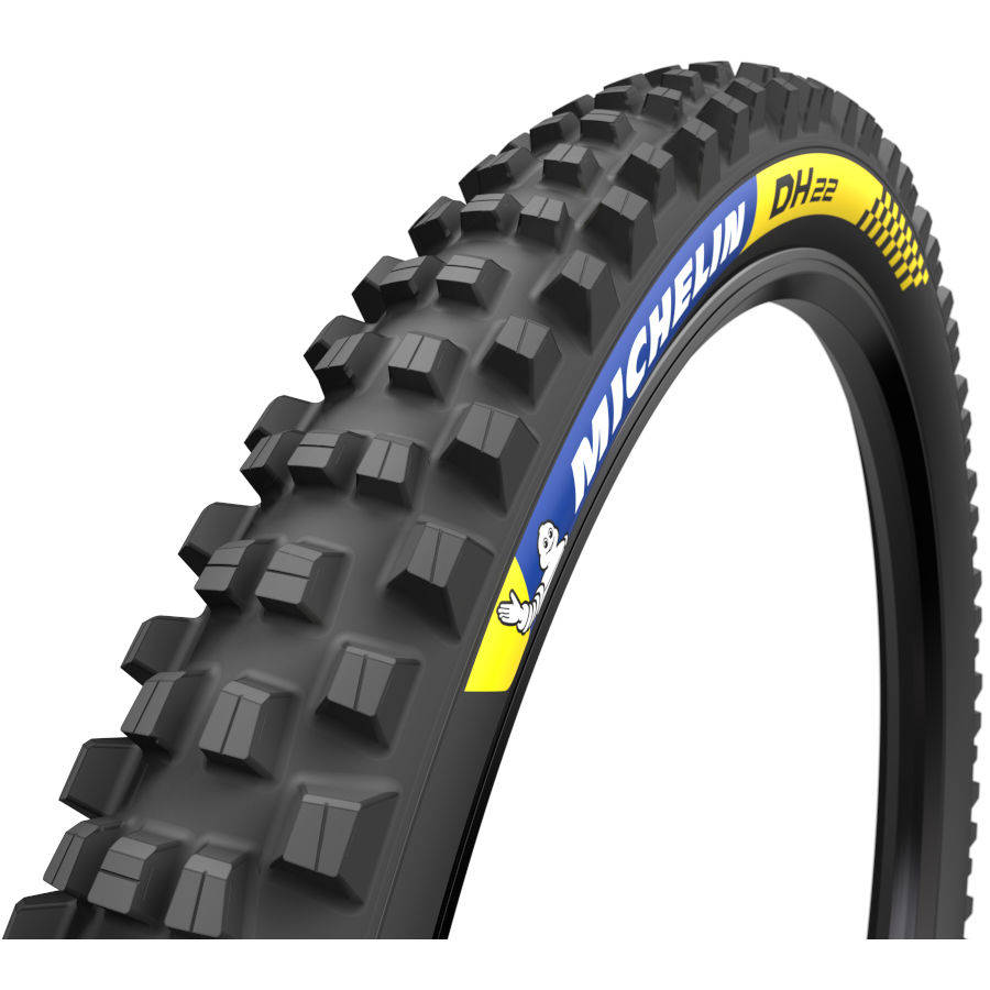 標誌 桌布 壁紙 — 黑色Michelin DH22登山車輪胎特寫，具有侵略性塊狀胎紋和藍黃色品牌標識，背景為白色。