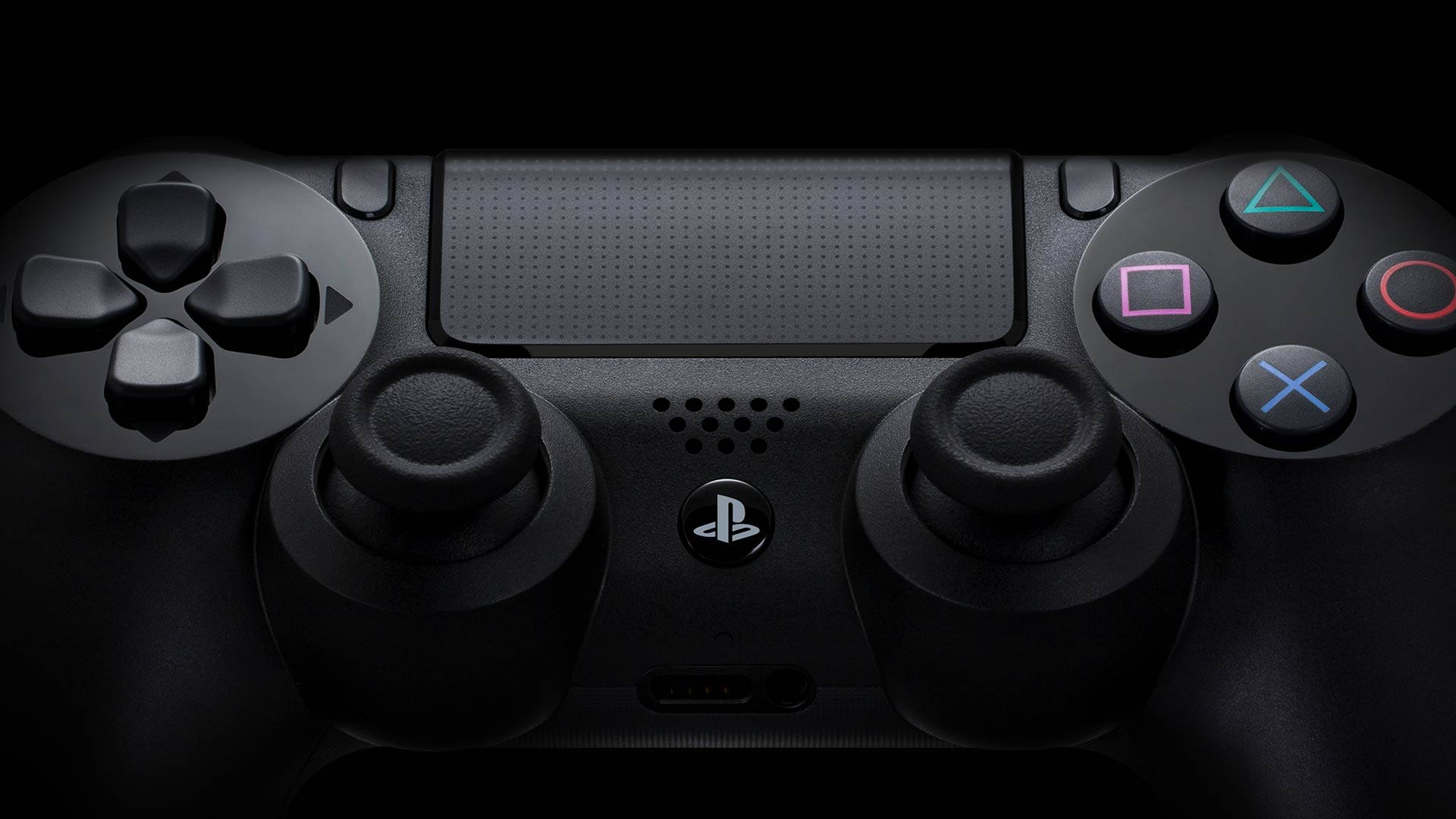 黑色PlayStation控制器，在黑暗環境中帶有發光按鈕。 — Ps4 壁紙