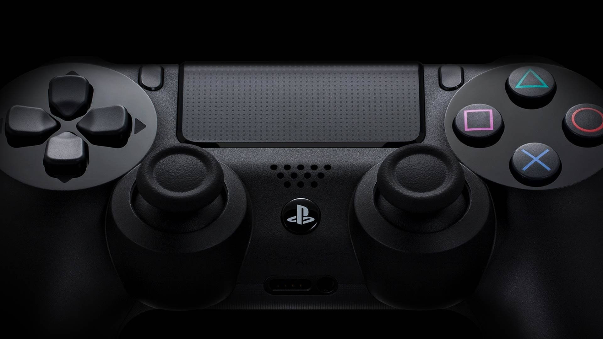 黑色PlayStation控制器，在黑暗環境中帶有發光按鈕。 — Ps4 壁紙