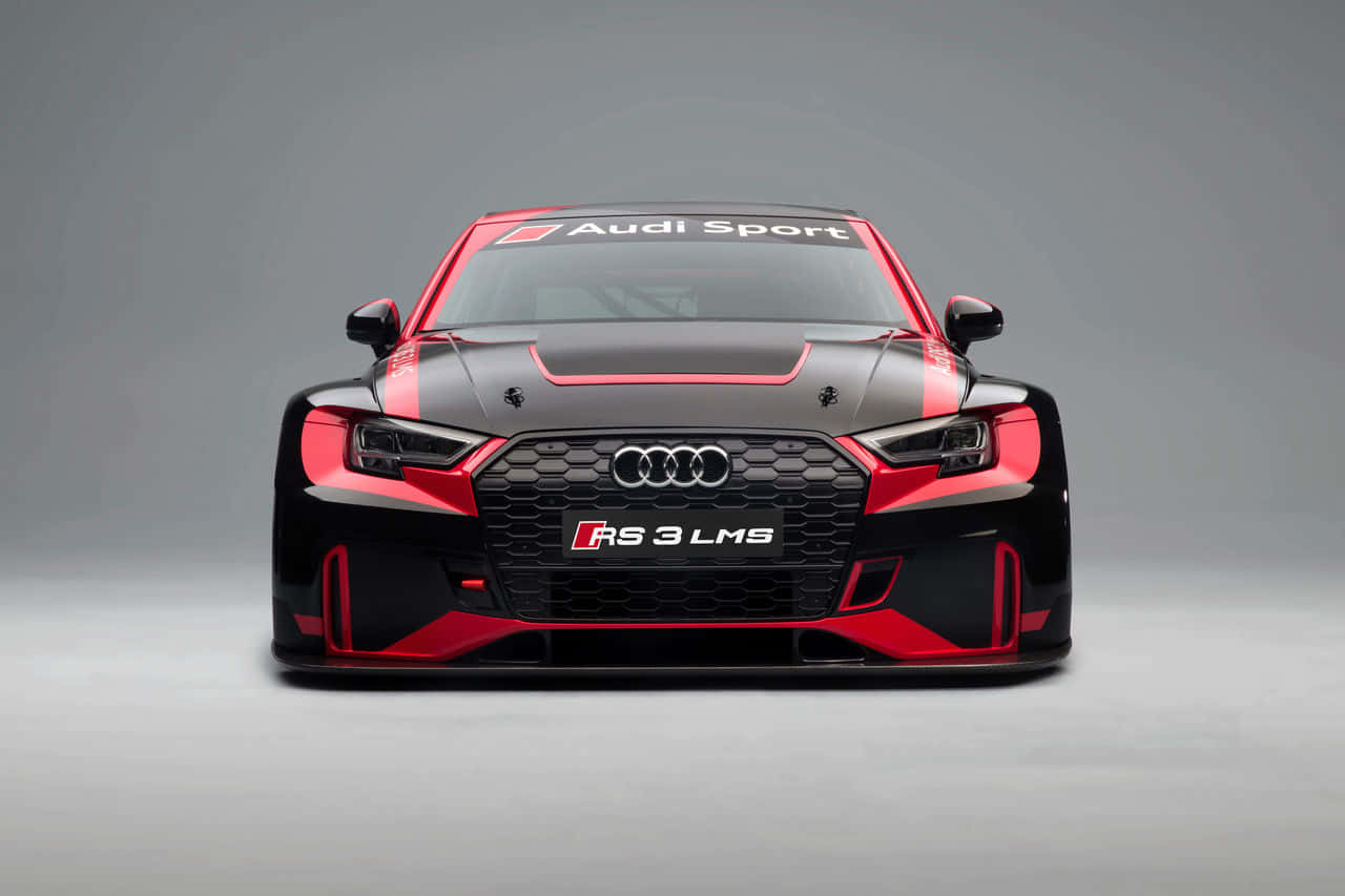 奧迪 桌布 壁紙 — 黑色和紅色 Audi RS 3 LMS 賽車的正面視圖，帶有 'Audi Sport' 品牌標誌，背景為中性灰色工作室。