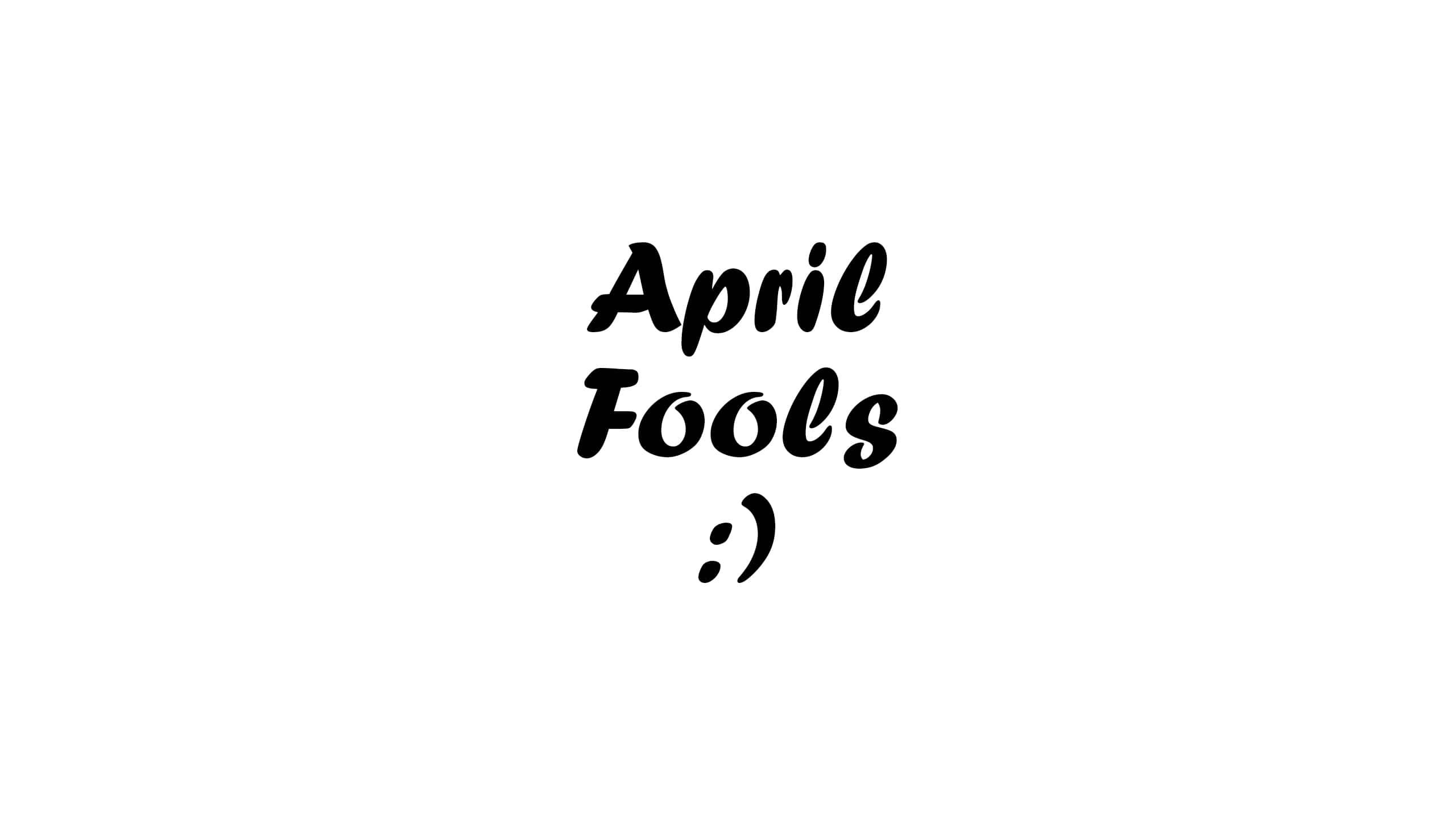 Fools 桌布 壁紙 — 黑色手寫愚人節文字，中間有一個笑臉，位於純白色背景上。