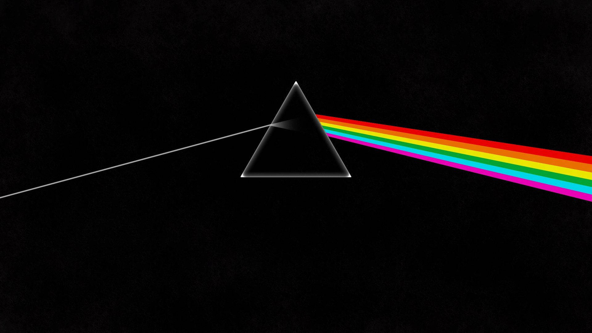 Floyd 桌布 壁紙 — 黑色玻璃棱鏡將白色光束分裂成鮮豔的彩虹光譜，背景為深色紋理。