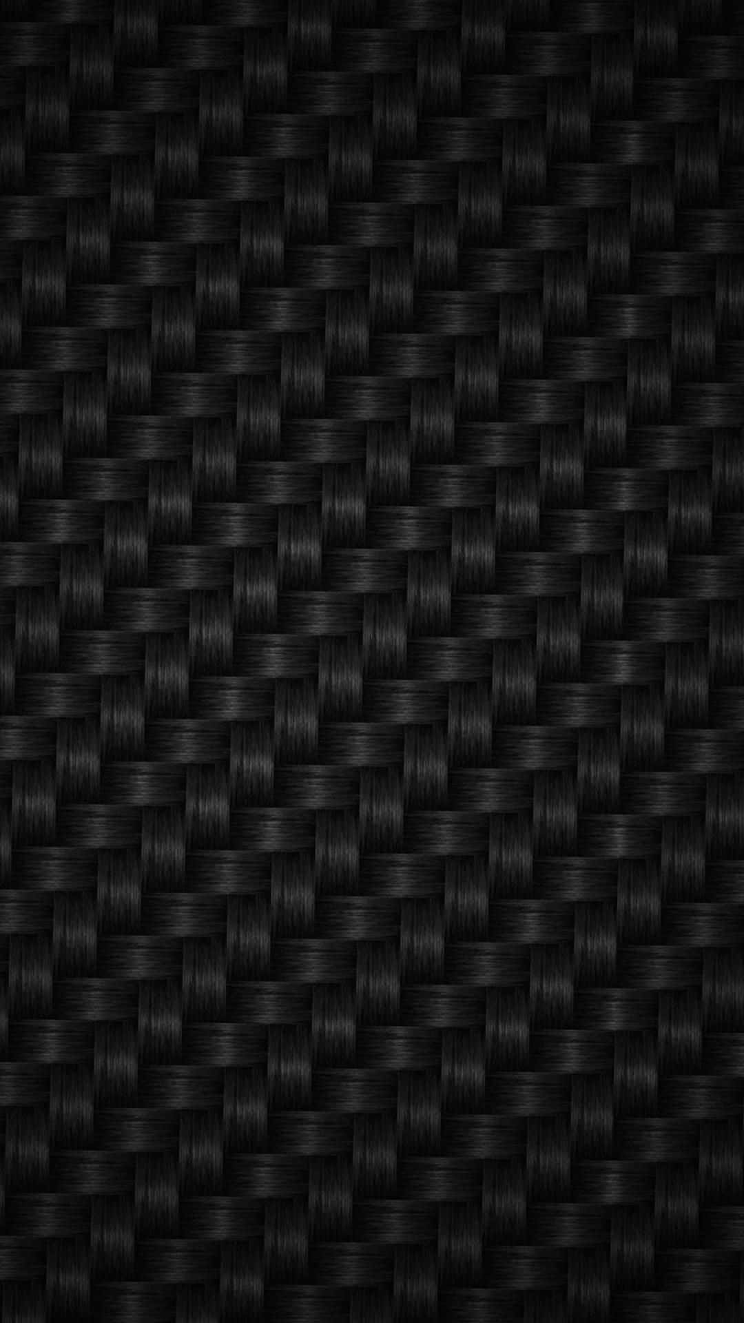 Carbon Fiber iPhone 桌布 壁紙 — 黑色碳纖維編織的緊密特寫，帶有細微光澤和精確的斜紋圖案。