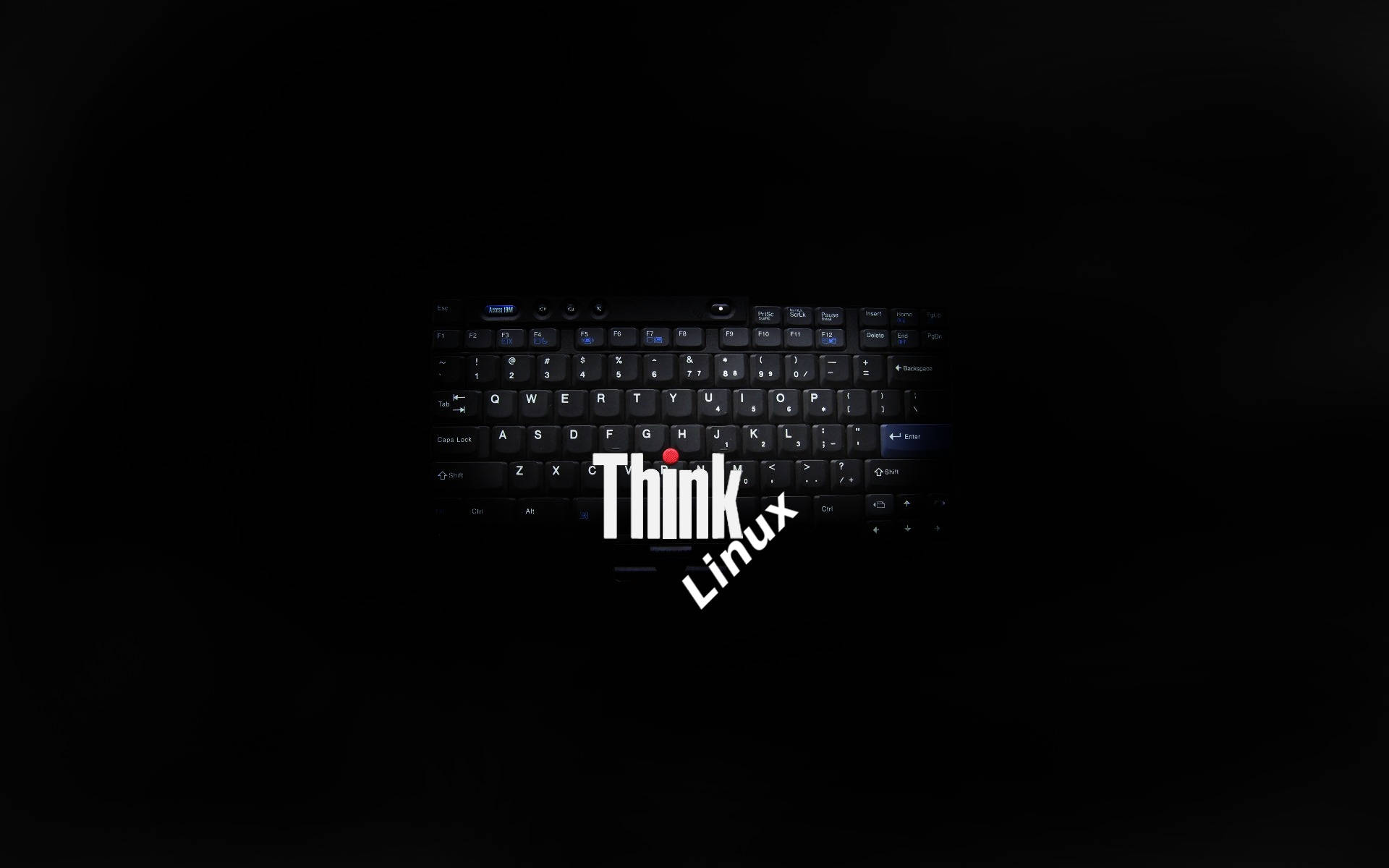 Linux 桌布 壁紙 — 黑色筆記型電腦鍵盤置於黑暗中，中央有發光白色「Think Linux」文字及紅點標誌。