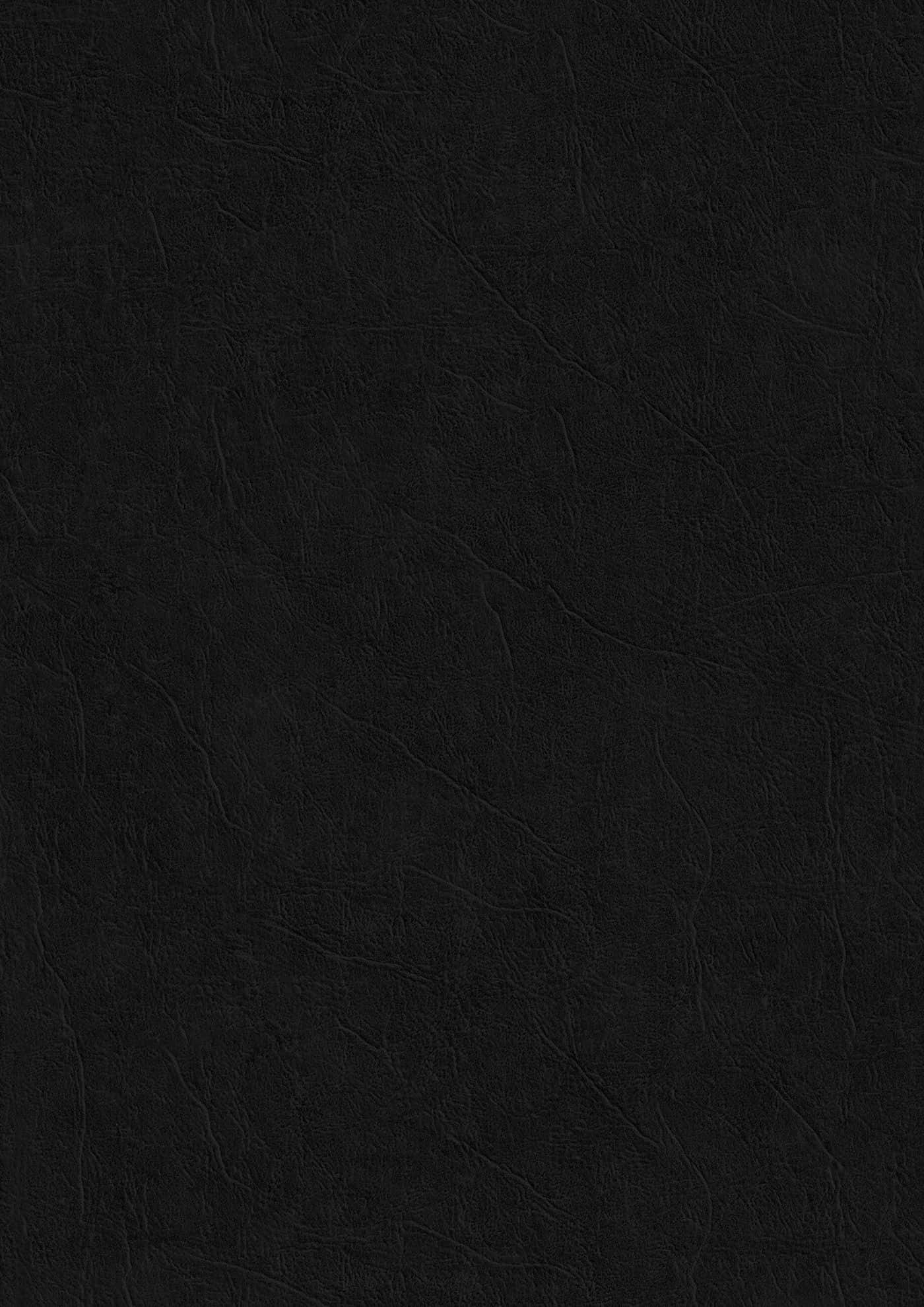Black Paper Texture 桌布 壁紙 — 黑色紋理皮革表面的特寫，帶有細微皺摺和天然粒面圖案。