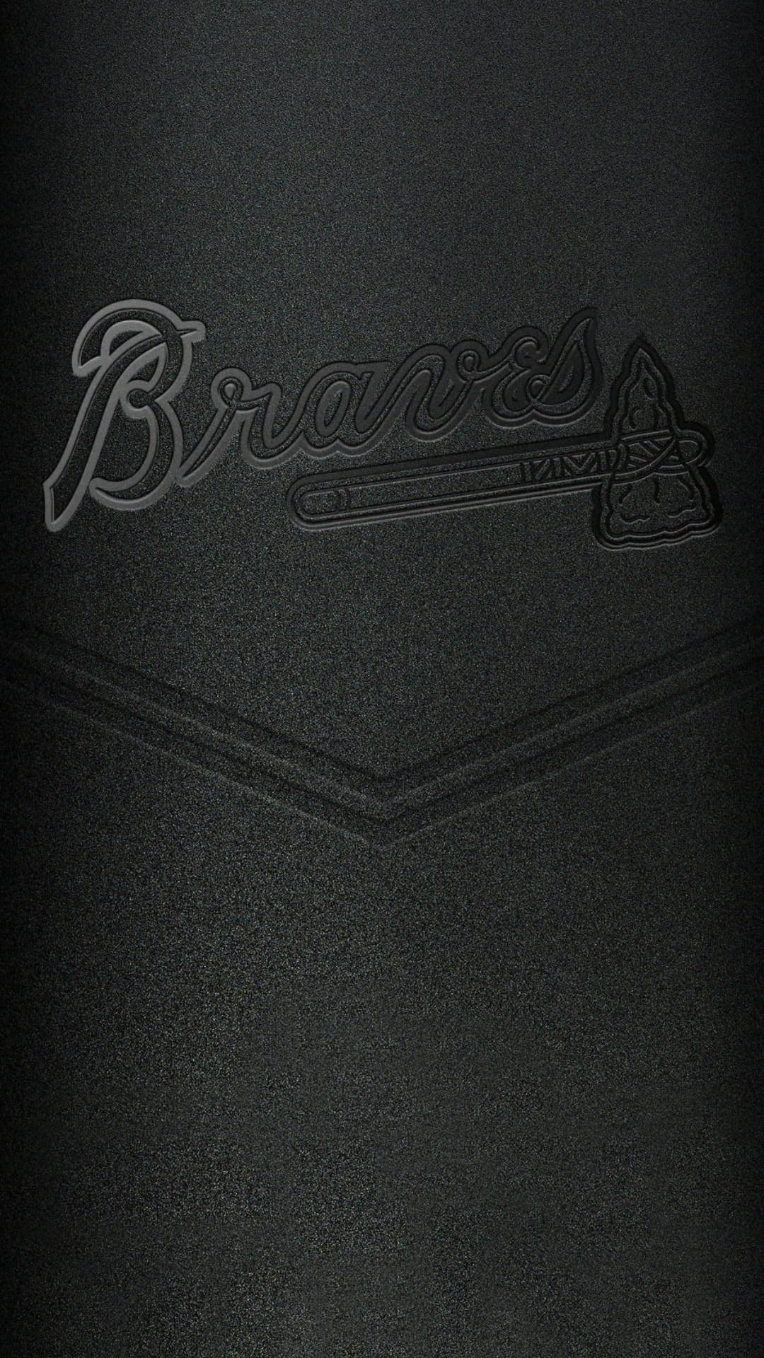 黑色 桌布 壁紙 — 黑色紋理表面的特寫，帶有壓印的Braves標誌，包含球棒和戰斧。