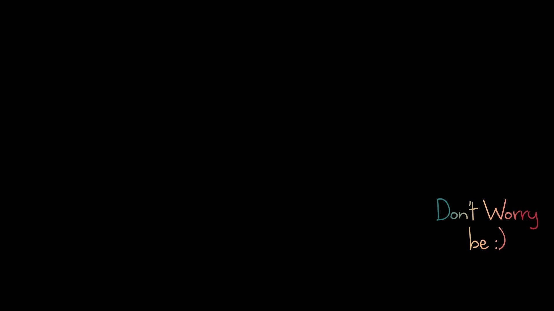笑臉 桌布 壁紙 — 黑色背景，右下角有彩色手寫文字寫著「Don't Worry be :)」。