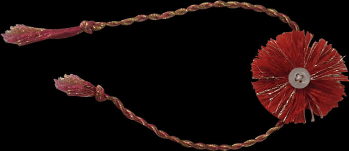 Bracelet 桌布 壁紙 — 黑色背景上，一條帶有扭紋金繩和流蘇的紅色流蘇裝飾頭帶。