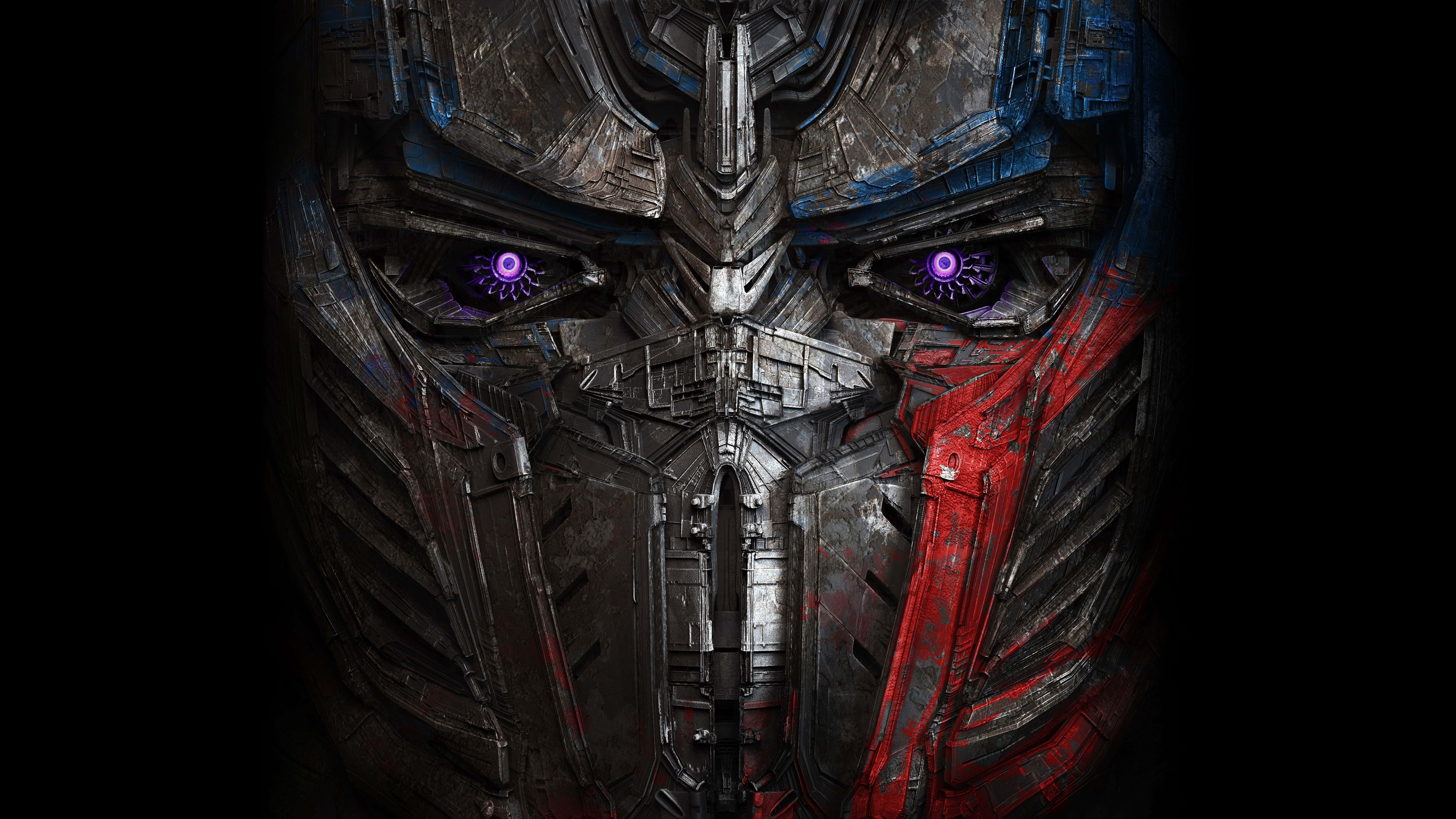Optimus Prime 4K 桌布 壁紙 — 黑色背景上，柯博文金屬面孔的特寫，帶有發光的紫色眼睛。