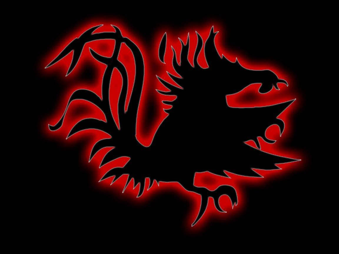 South Carolina Gamecocks 桌布 壁紙 — 黑色背景上，發光的紅色龍剪影，帶有尖銳的棘刺和爪子。