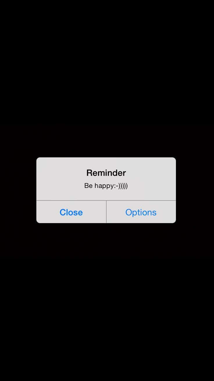 Aesthetic Reminder 桌布 壁紙 — 黑色背景上一個簡約的提醒彈出視窗，用笑臉鼓勵快樂。