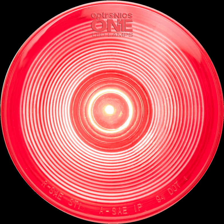 Red Light 桌布 壁紙 — 黑色背景上帶有同心脊線和品牌文字的發光紅色圓形LED燈的特寫。