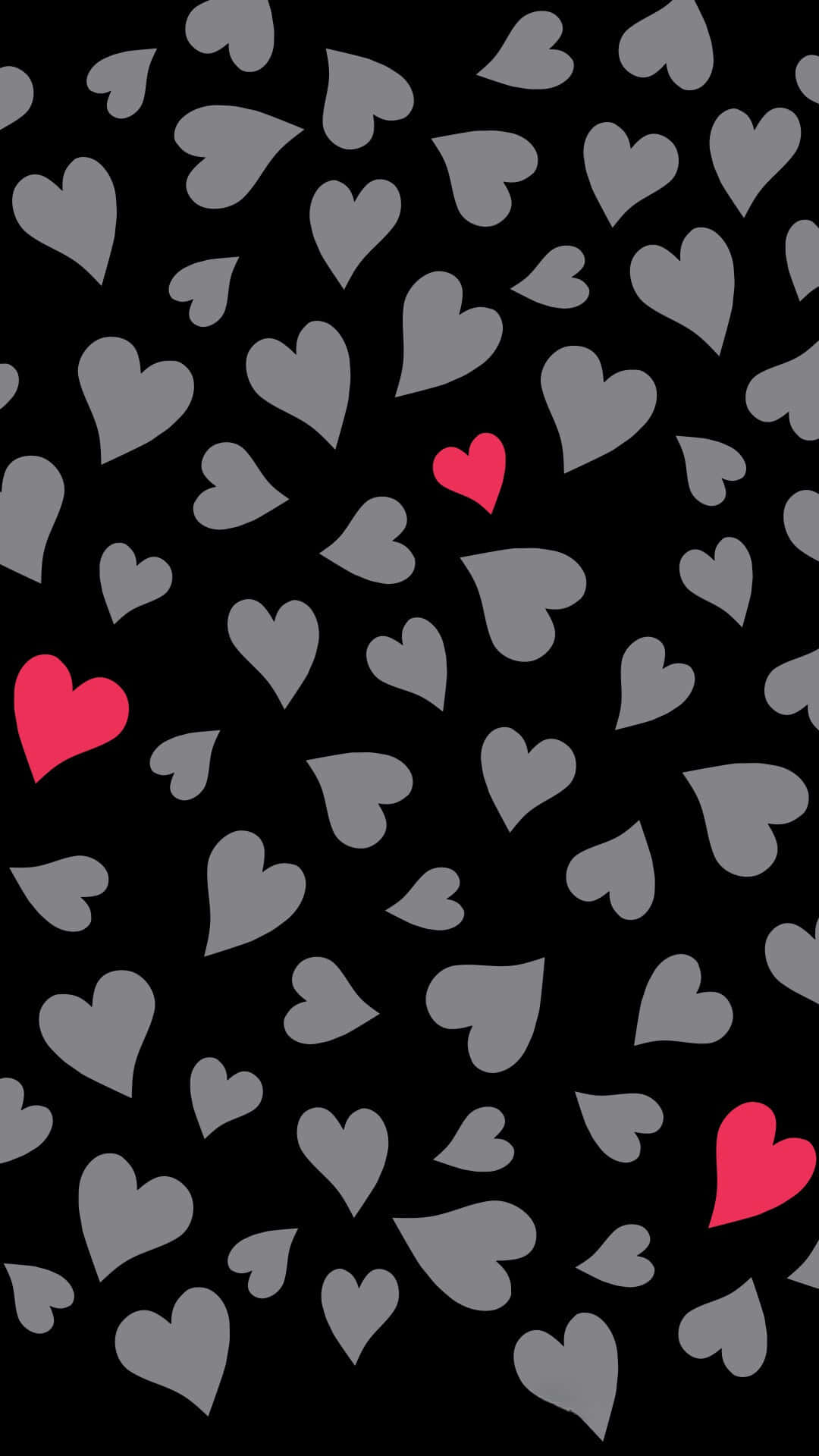 Cute Hearts 桌布 壁紙 — 黑色背景上散落著灰色心形，並有三顆鮮豔的粉紅色心形增添對比。
