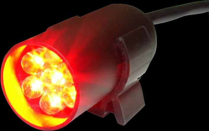 Led Light 桌布 壁紙 — 黑色背景上溫暖發光的紅色LED燈具特寫。