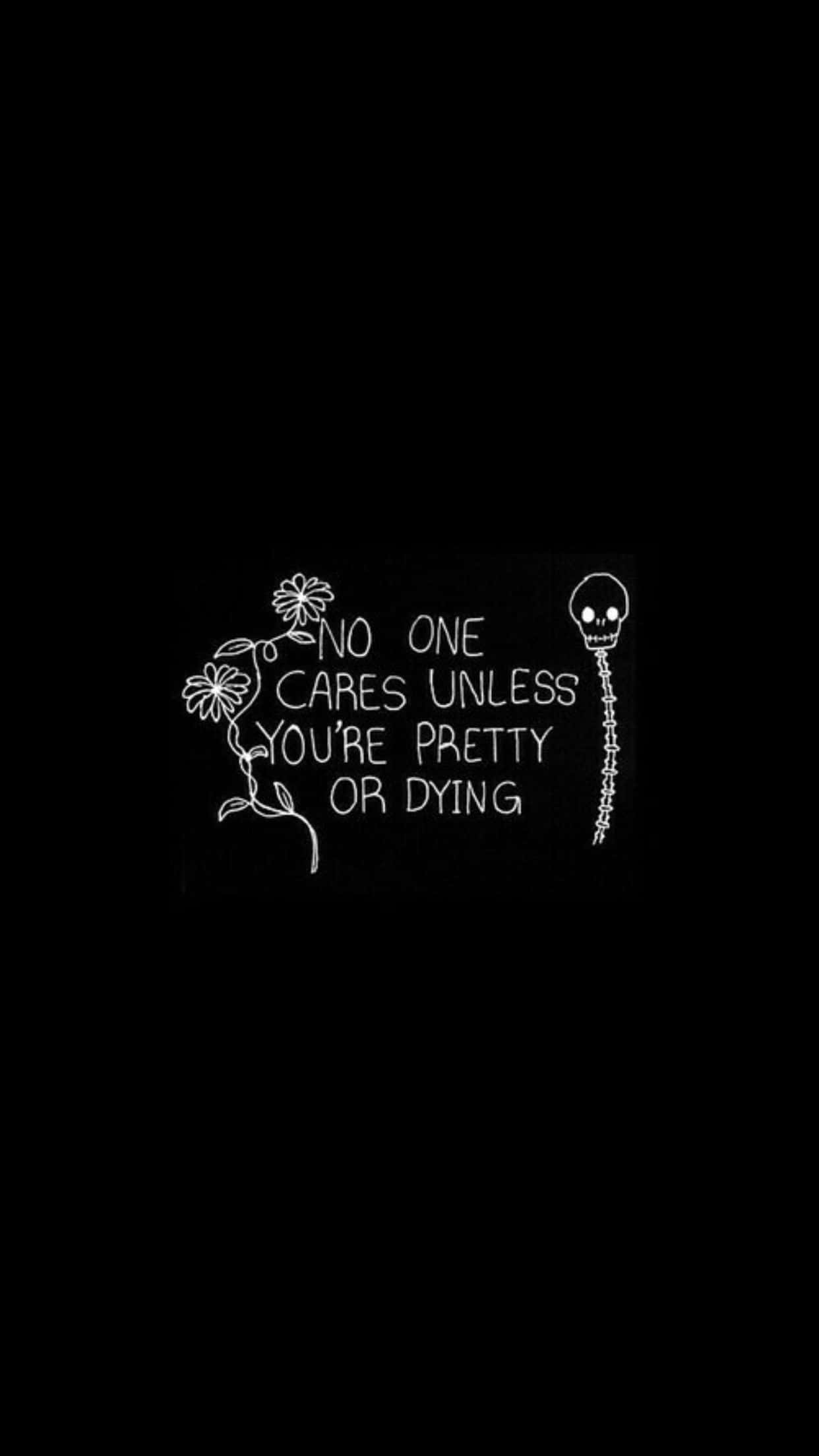 桌布 壁紙 — 黑色背景上的白色手寫文字寫著「NO ONE CARES UNLESS YOU'RE PRETTY OR DYING」，兩側有一朵花和一個骷髏頭。