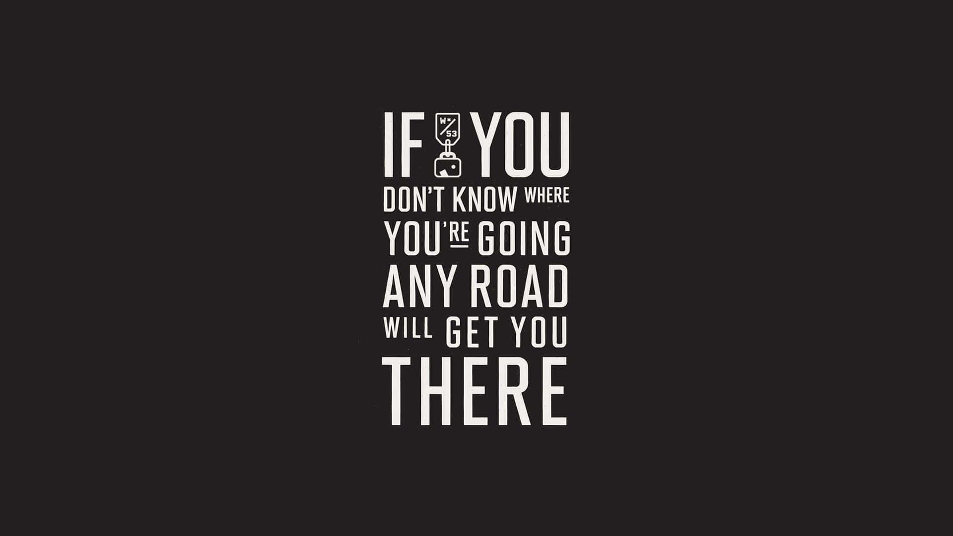 Minimalist Quote 桌布 壁紙 — 黑色背景上粗體白色文字寫著「IF YOU DON'T KNOW WHERE YOU'RE GOING ANY ROAD WILL GET YOU THERE」，其中「YOU」的「O」被行李箱圖示取代。