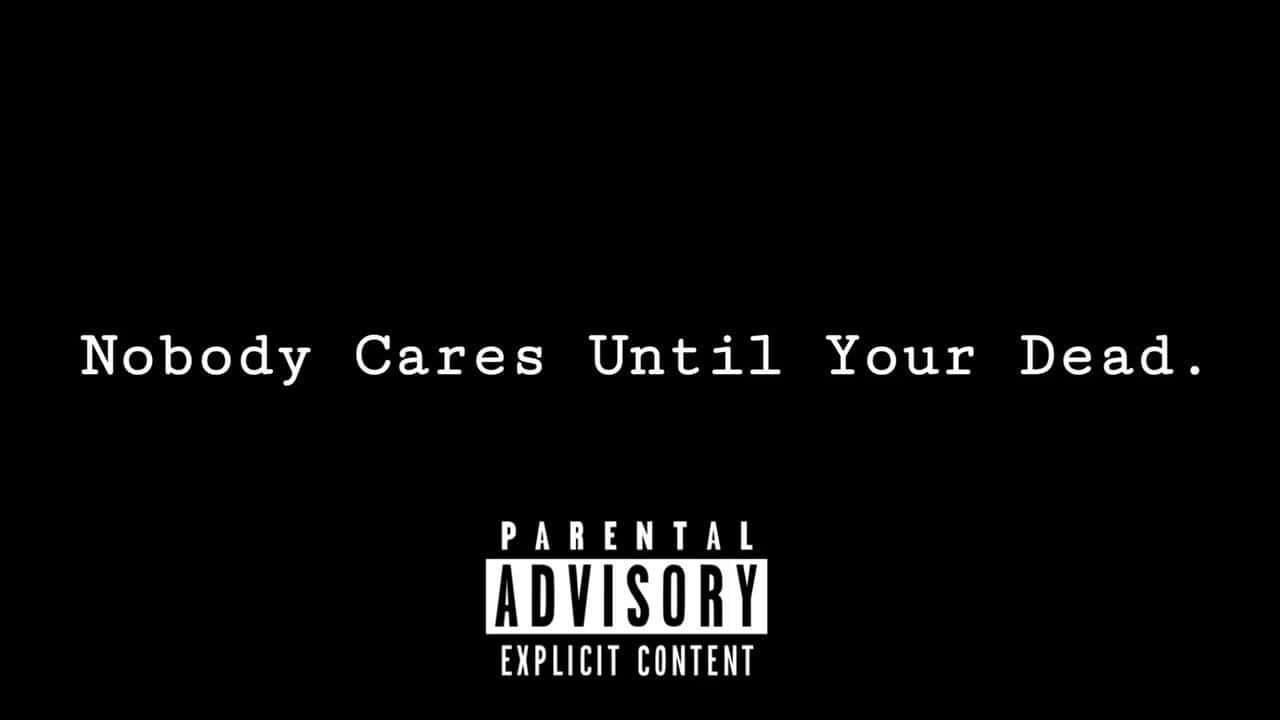 xxxtentacion 電腦 桌布 壁紙 — 黑色背景上粗體白色文字寫著「Nobody Cares Until Your Dead.」，下方有Parental Advisory Explicit Content標籤。