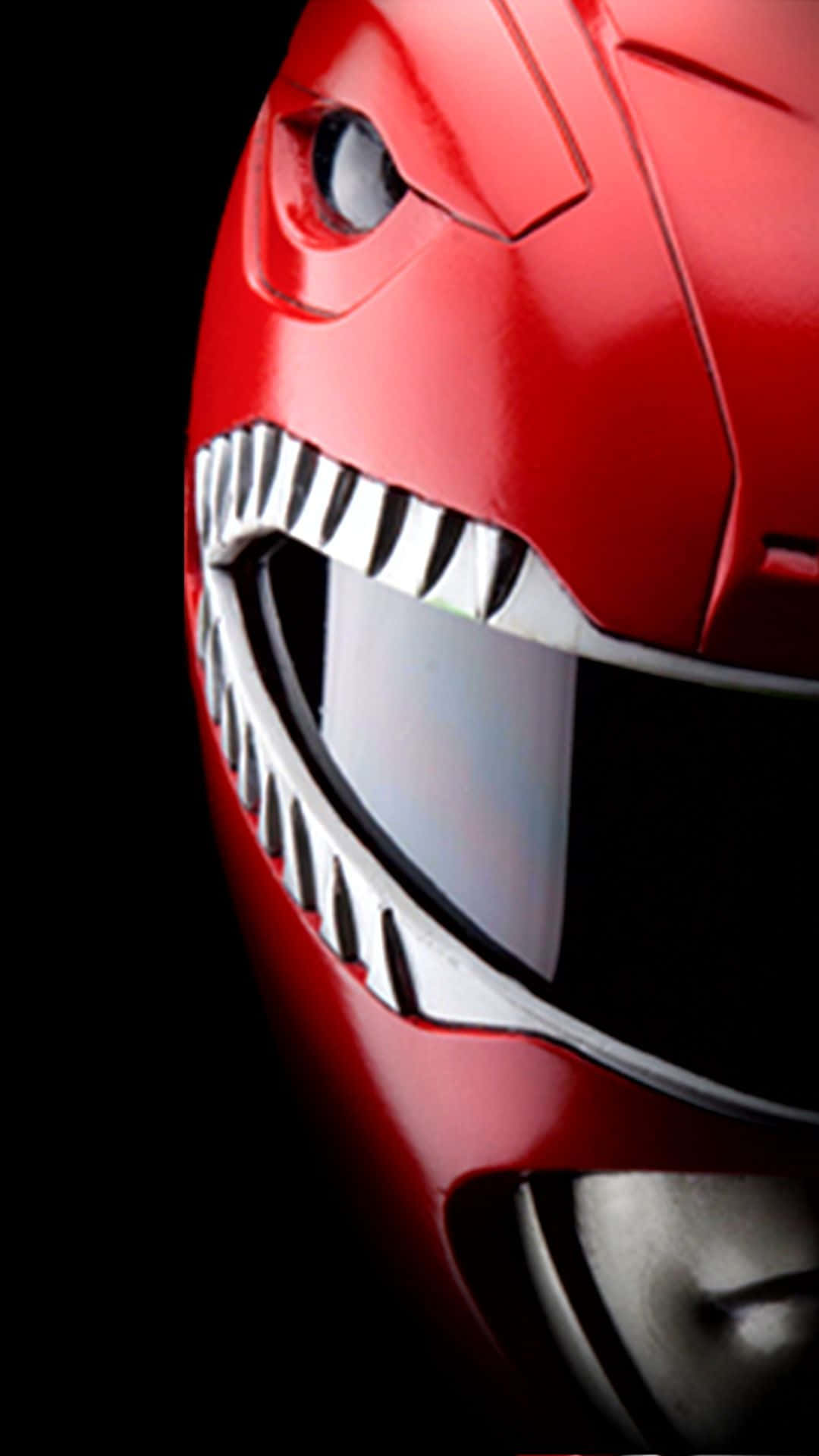 金剛戰士 桌布 壁紙 — 黑色背景上紅色Power Ranger頭盔的特寫，帶有鋒利的白色牙齒和發光的眼睛。